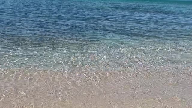 Pristine beach helicopter flyby