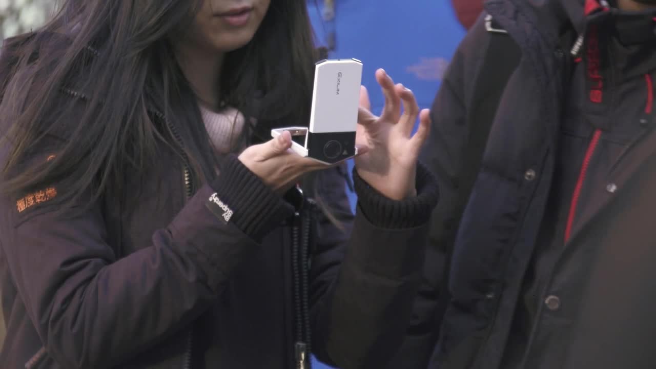 Young Couple Using Camera in Tokyo