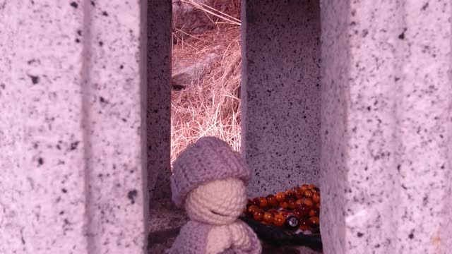 Doll in stone lantern