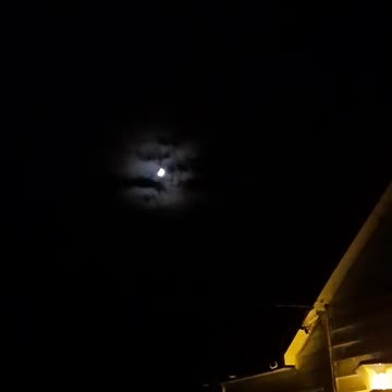 Freaky! The moon has clouds behind it?