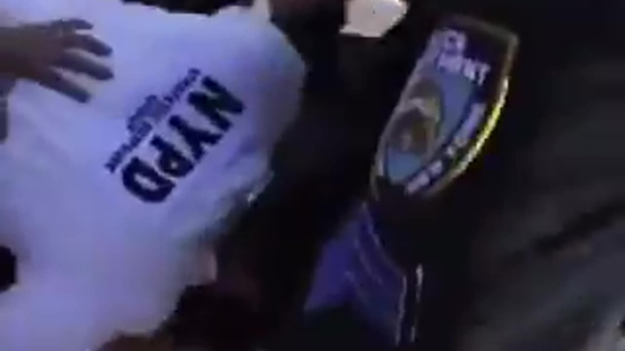 NYPD Captain Knocking Female Protester and Punching Her non-stop.