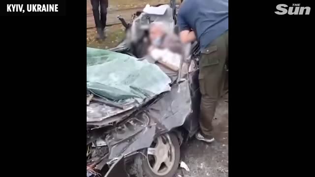 Ukraine invasion - TANK crushes civilian car in Kyiv but driver is miraculously rescued alive