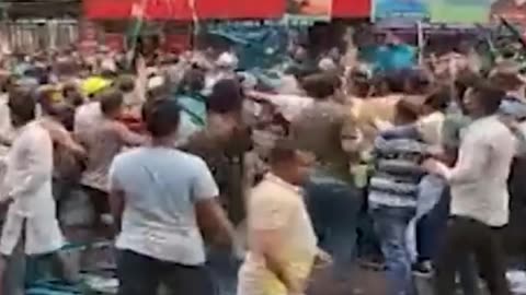 Throwing chairs at Dhaka Metropolitan South Awami League's peace rally on Bangabandhu Avenue