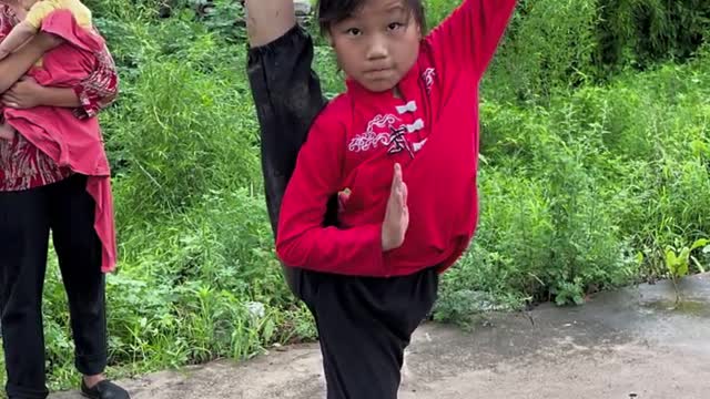 Practice martial arts together. Little girl practicing kung fuPractice martial arts together.