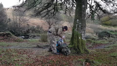 Getting audio equipment ready for filming by a noisy river for filming