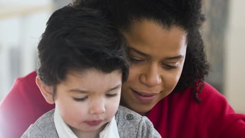 Video of a Woman Holding a Boy