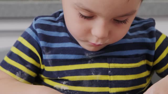 A Toddler trying to cook