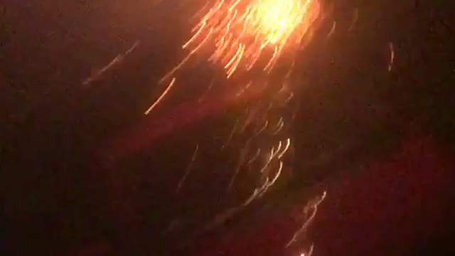 Beard selfie gets shot from behind by roman candle