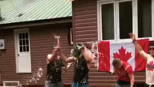 Four canadien bros open mini kegs with hatchet and chug beer