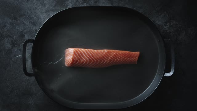 Salmon in A Pan With A Bit of Water