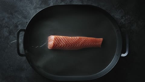 Salmon in A Pan With A Bit of Water