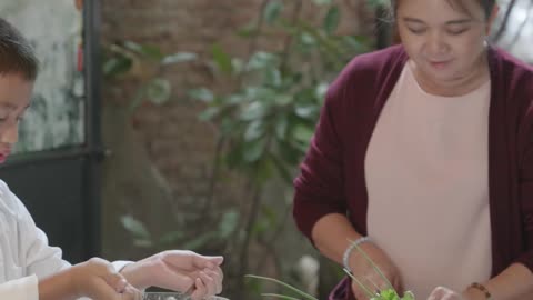 Kids Helping Their Grandmother Preparing Food