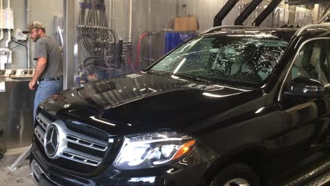 Meg gets a bath at her new car wash.