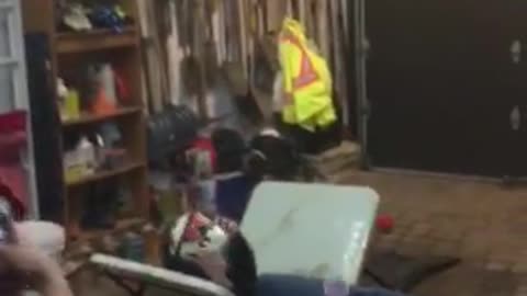 White and red helmet guy jumps onto white table folds and hits head