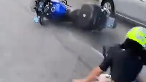 chick riding bike is more concerned about her selfie then her safety