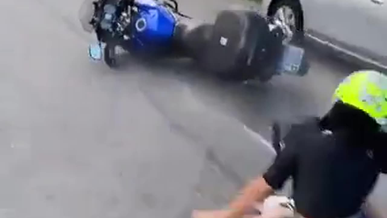 chick riding bike is more concerned about her selfie then her safety