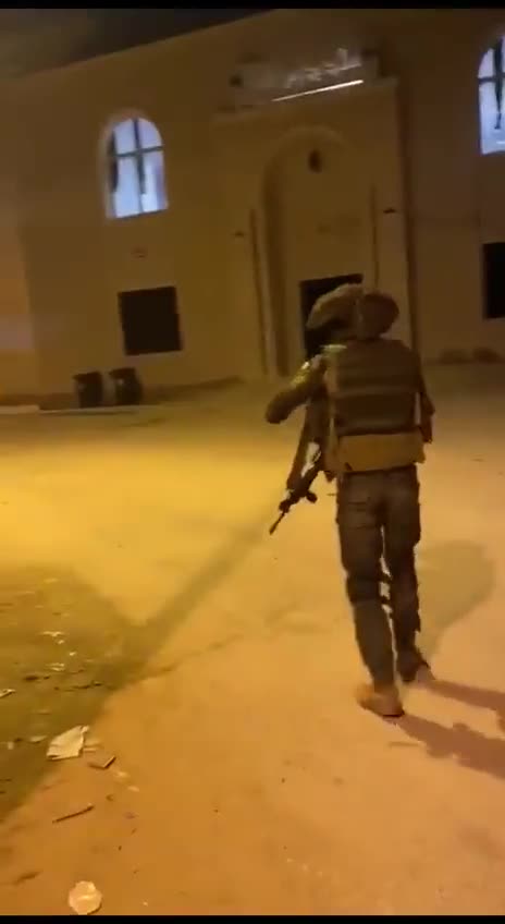 sick Israeli soldier asks another soldier to video him as he throws a bomb inside a West Bank mosque