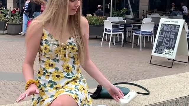 Boy turns girls coffee into empty cup