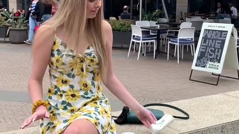 Boy turns girls coffee into empty cup