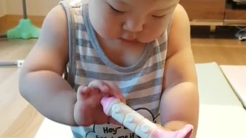 This is a video of a baby playing with toys and having fun.