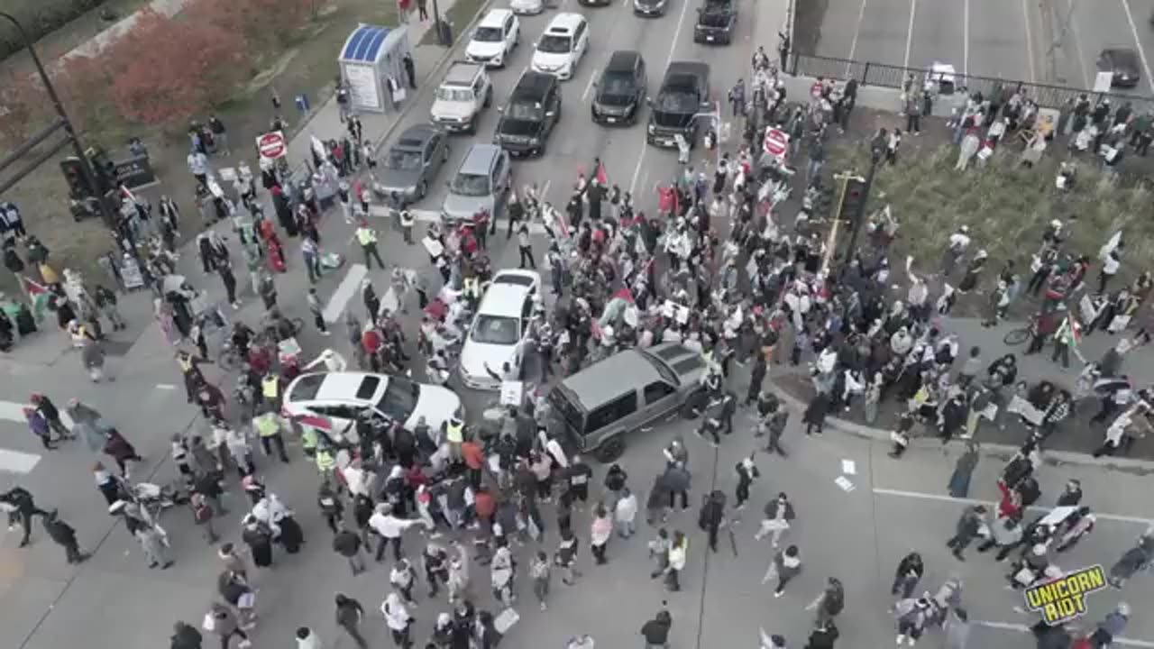 Aerial Shot of Mob Swarming Car