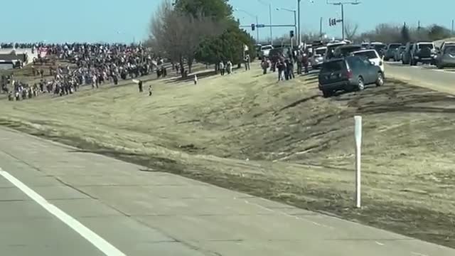 An INSANE number of Americans lined up on the highway to show their support