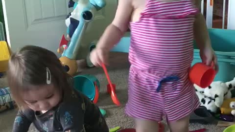 Playing with her favorite little buddy
