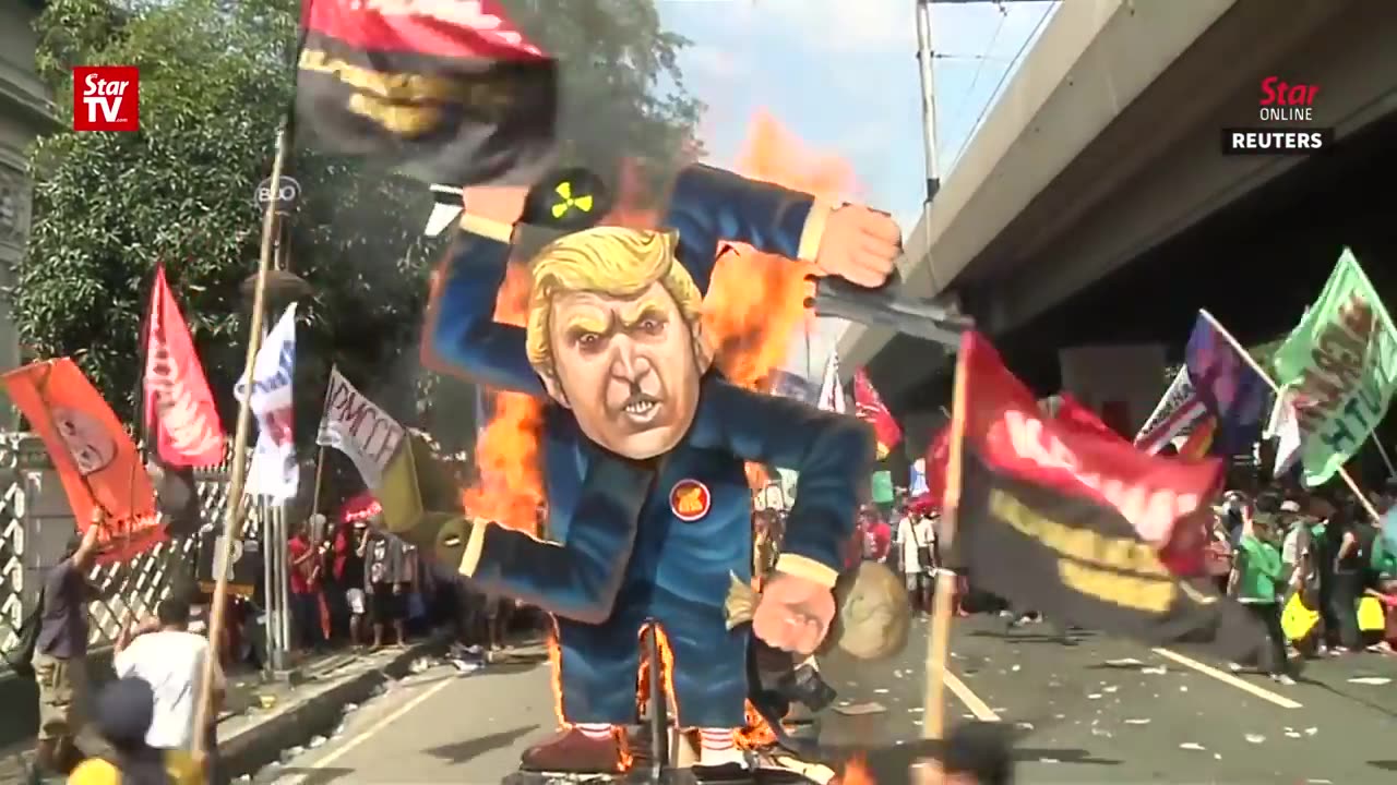 Trump's effigy set on fire in protests against his Philippines visit