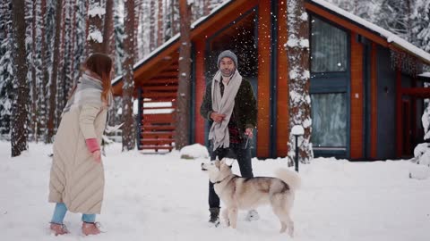 A family enjoying happy moments with their dog