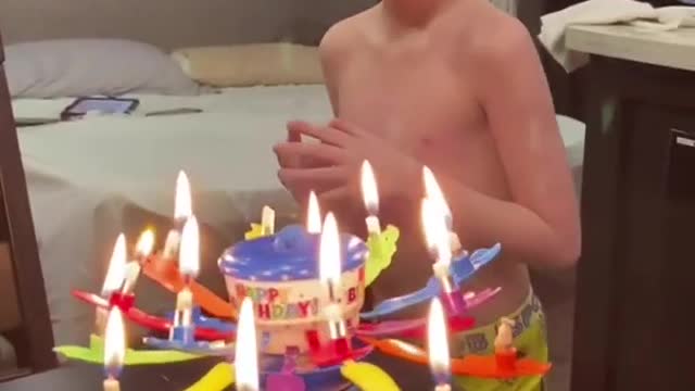 Kid Awestruck With His Birthday Cake Blows at Fancy Candles on it