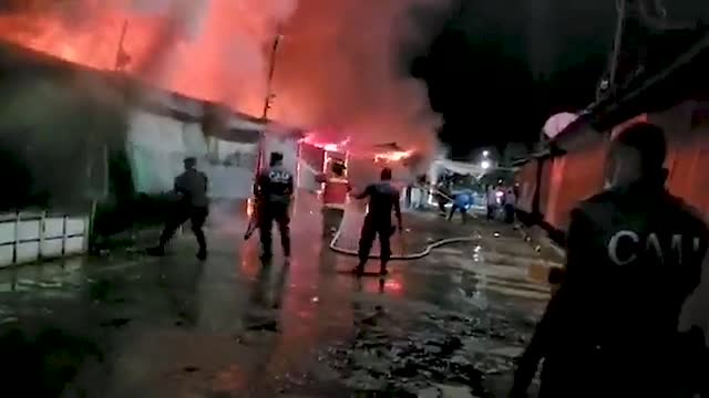 Firefighters Tackle El Salvador Market Blaze