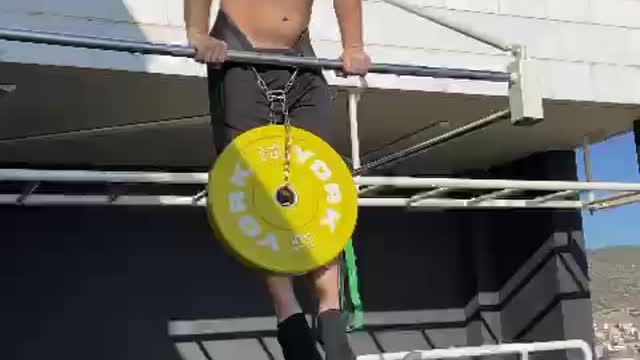 heavyweight muscle up + 15 kg