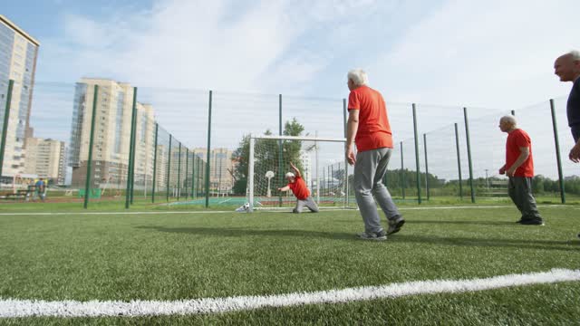 Funny old mans playing football with each others