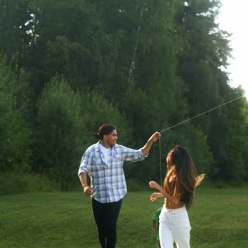 People Playing a Kite