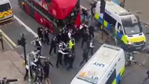 Police try to separate immigrants fighting in London