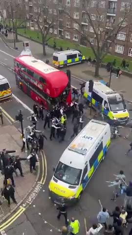 Police try to separate immigrants fighting in London