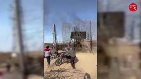 MOMENT: Palestinians celebrate at destroyed Israel-Gaza border fence