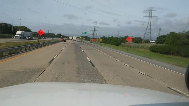 SUV Launches Over Highway Barrier