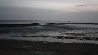 Evening on a beach. At low tide.