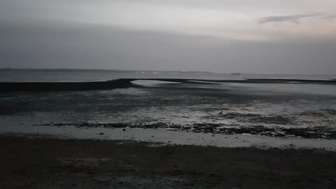 Evening on a beach. At low tide.