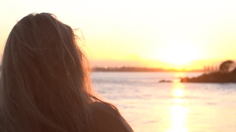 A sensational sunset and a beautiful woman.