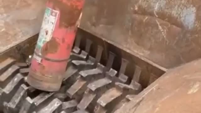 Powerful Crushing Machine Crushing a Fire Extinguisher