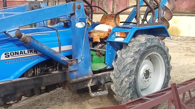 Tractor driving a cat