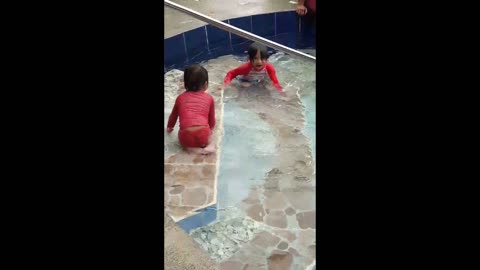 KIDS SWIMMING IN THE POOL