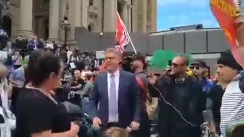 Aussie Patriots Run Snake News Reporter, Nick McCallum, Off The Steps Of the Melbourne Parliament