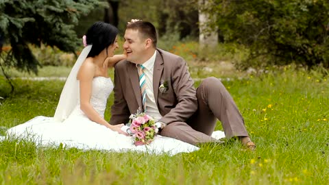 Happy newlywed couple in the park