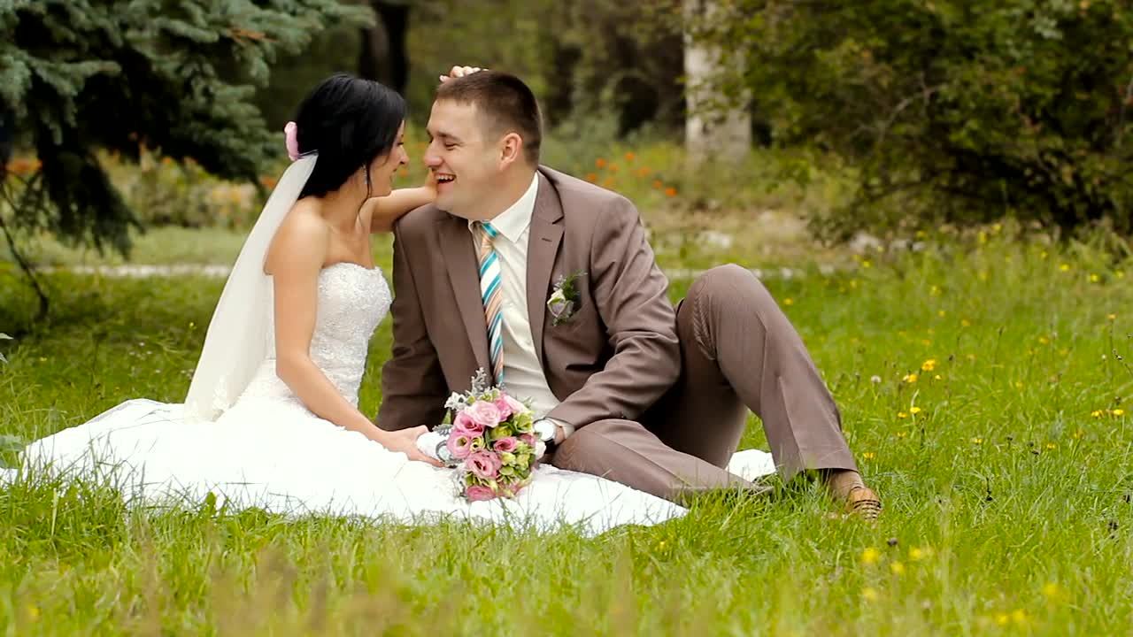 Happy newlywed couple in the park