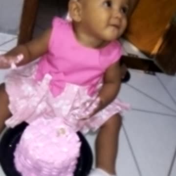 baby playing with cake