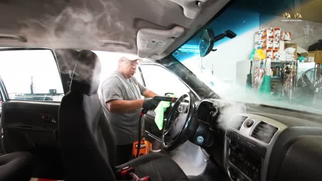 Dope slow-mo vid of a guy disinfecting a vehicle with a fog blast