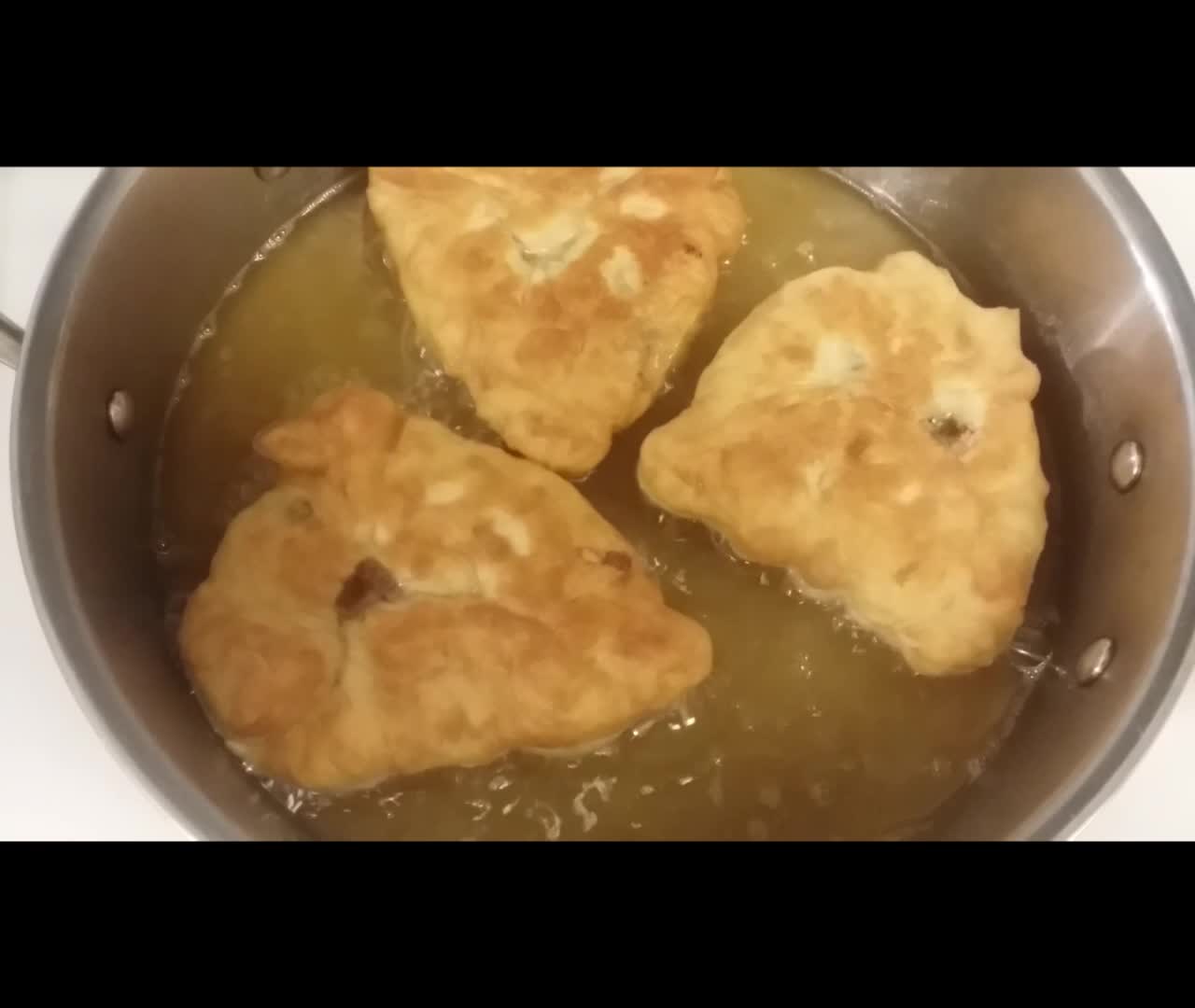 Siberian belyash - fried yeast dough pies with beef filling